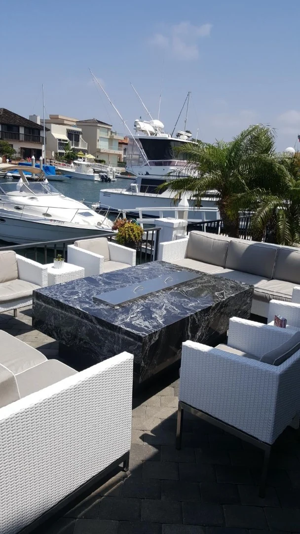 Granite fire pit table with a harbor view in San Diego