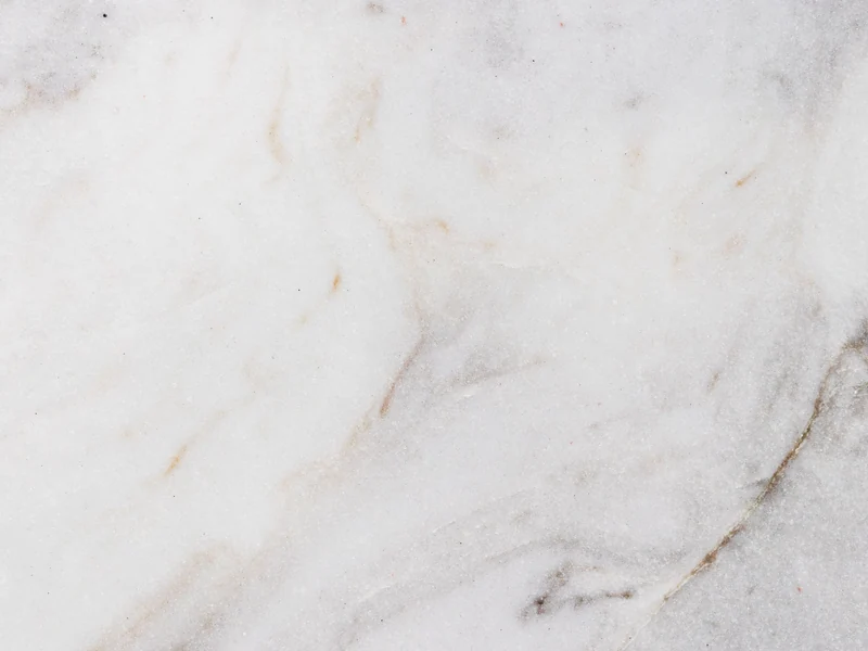 Close-up of white natural stone with soft gray veining
